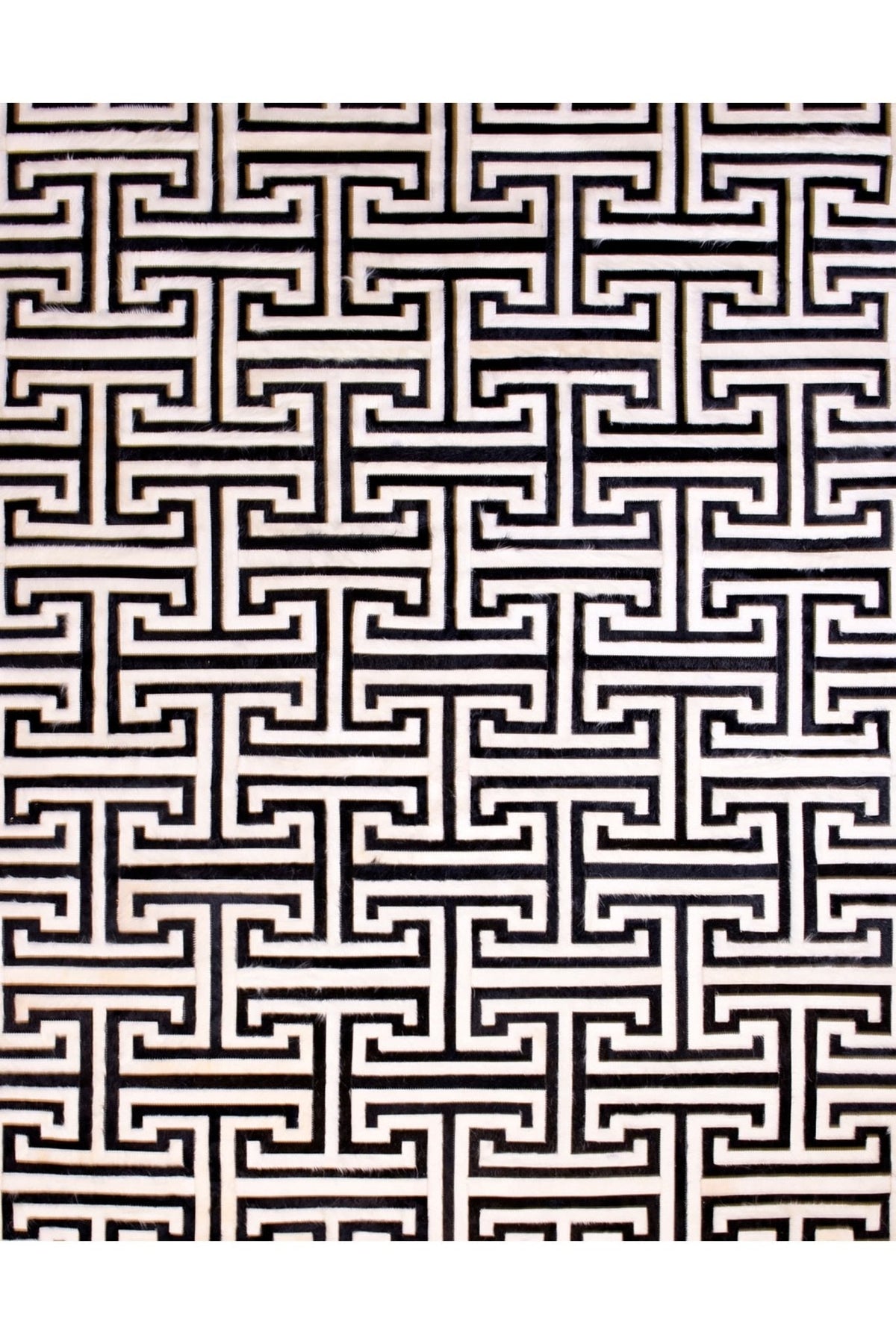 T MODEL – Maze-Inspired Cowhide Patch Rug