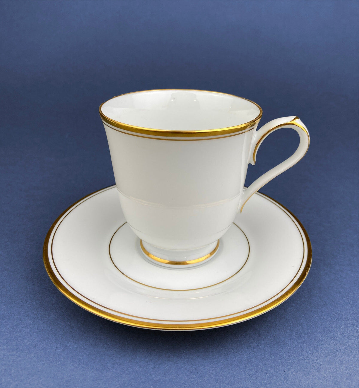 White China Cups and Saucers: Gold Embossed Band, Set of 5