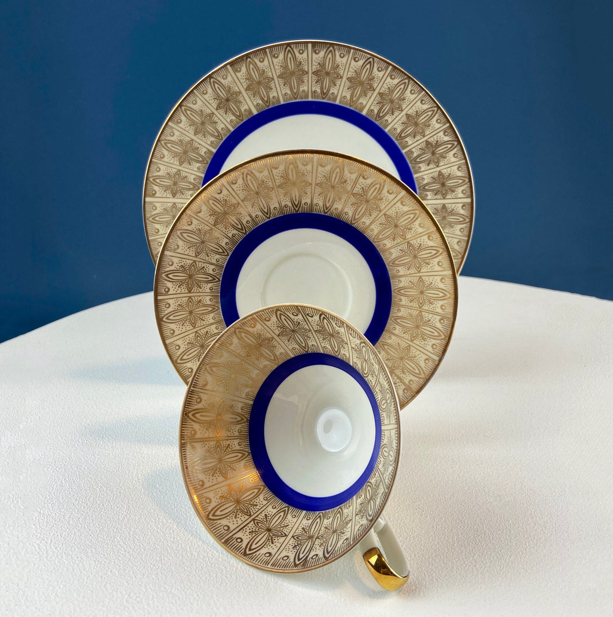 Antique Bavarian Porcelain Tea Trio. Z and Co, Tirschenreuther. Cup, Saucer, and Dessert Plate in Rich Gold and Blue. Modern Floral Pattern.