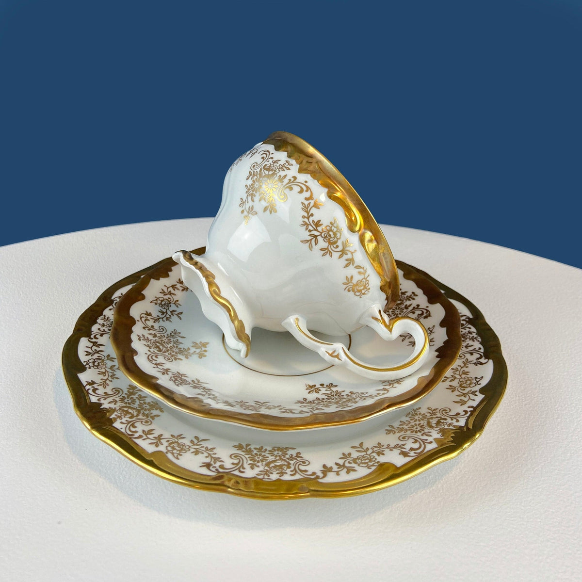 White and Gold Cup and Saucer. Paragon Porcelain, By Appointment to Her Majesty the Queen Potters. Dining Room Cabinet Display.